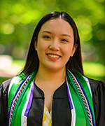 Photo shows Tiffany Bui, smiling in her graduation gown.