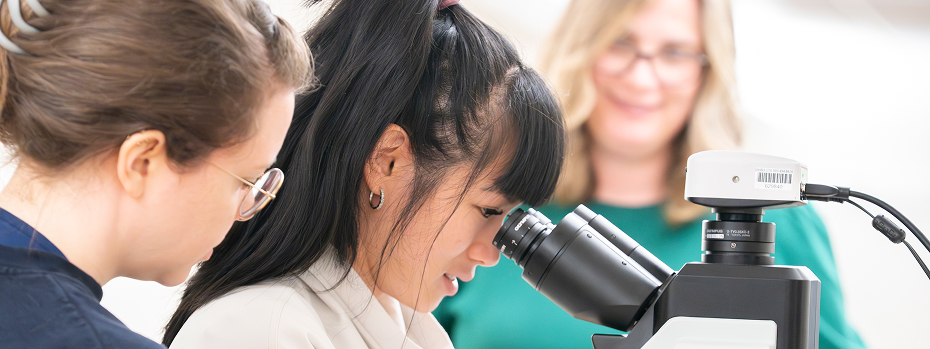 Pathology trainees examine an adequacy sample using the mobile cytology cart at OHSU.