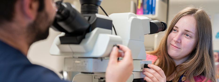 Dr. Erica Worswick, assistant professor of pathology and laboratory medicine, and recent resident teaching award winner, signs out a breast case with medical student fellow, Daniel Fullmer.