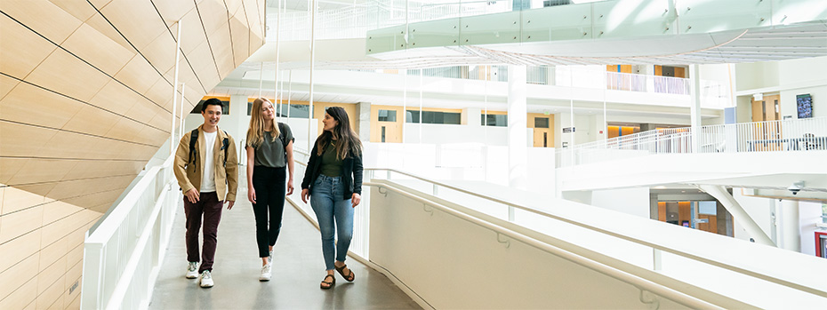 OHSU students walk together inside the RLSB building.