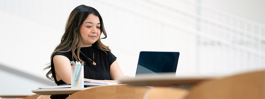 OHSU PA student studies at a desk with a laptop