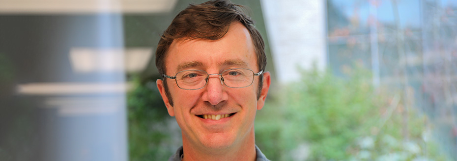 Portrait of Dr. Gregory Scott, an assistant professor of pathology at OHSU.