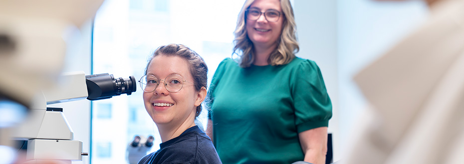 Chief resident Dr. Chloe Young (left), reviews cases in the resident room as Mandy VanSandt, D.O., residency program director and associate professor of pathology and laboratory medicine, offers consultation.