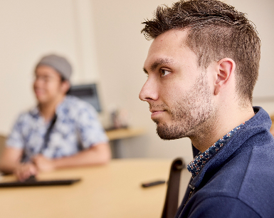 OHSU Ph.D. student Sam Sievertsen (right), listens during a meeting at the OHSU Mood Disorder Investigations Throughout Neurodevelopment (MIND) Lab, led by Dr. Rebekah Huber.