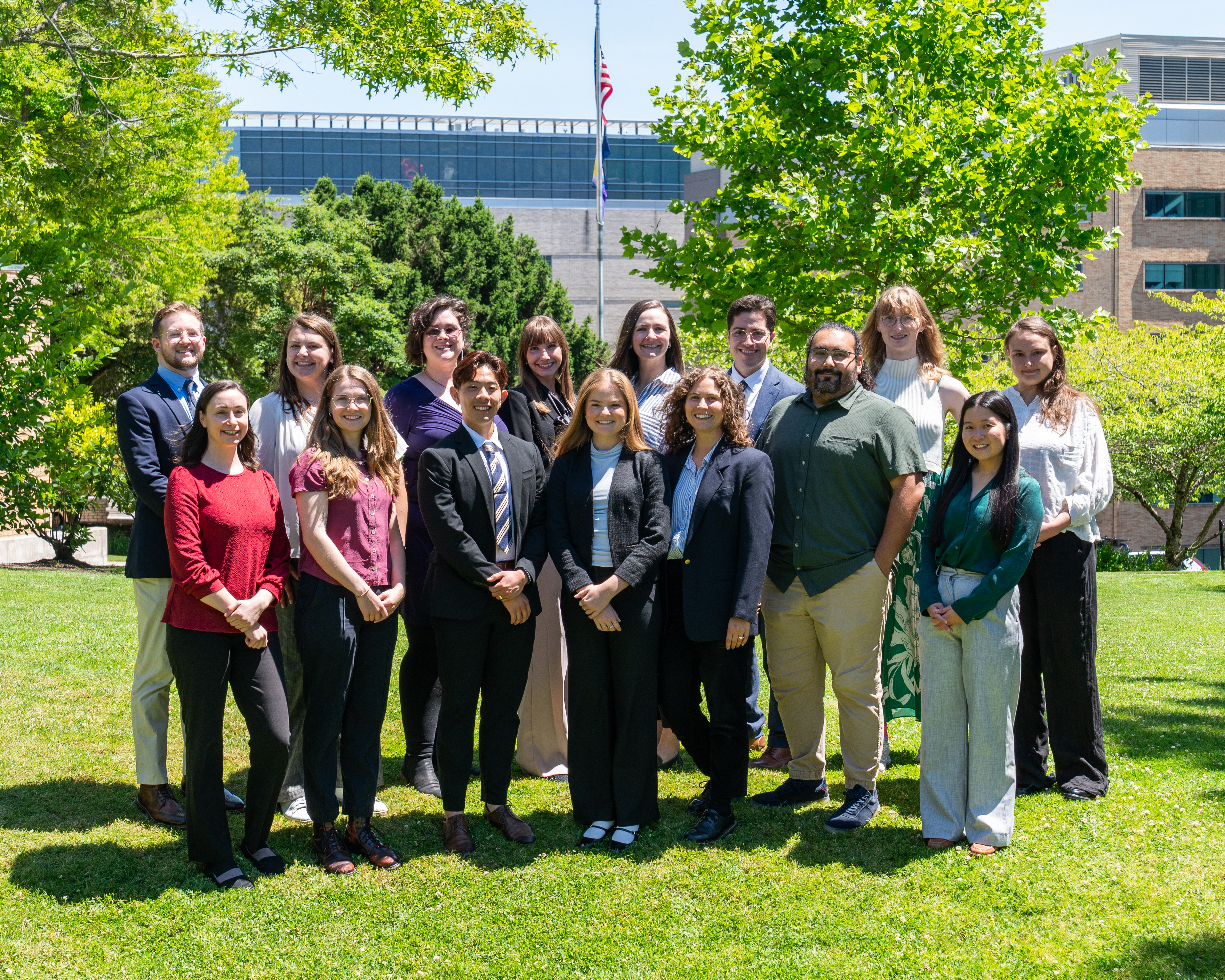 Group photo of family medicine residents wearing professional attire and smiling