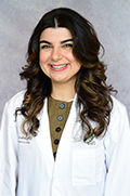Dr. Bebe Badiei smiles for a portrait photo