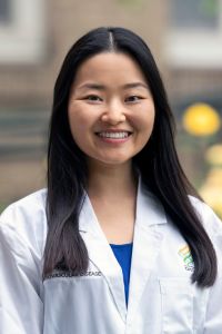 A professional headshot of Dr. Emily Xiao.
