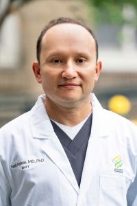A professional headshot of Dr. Ivan Areans.