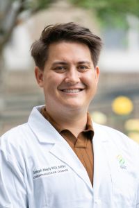 A professional headshot of Dr. Joseph Neeley.