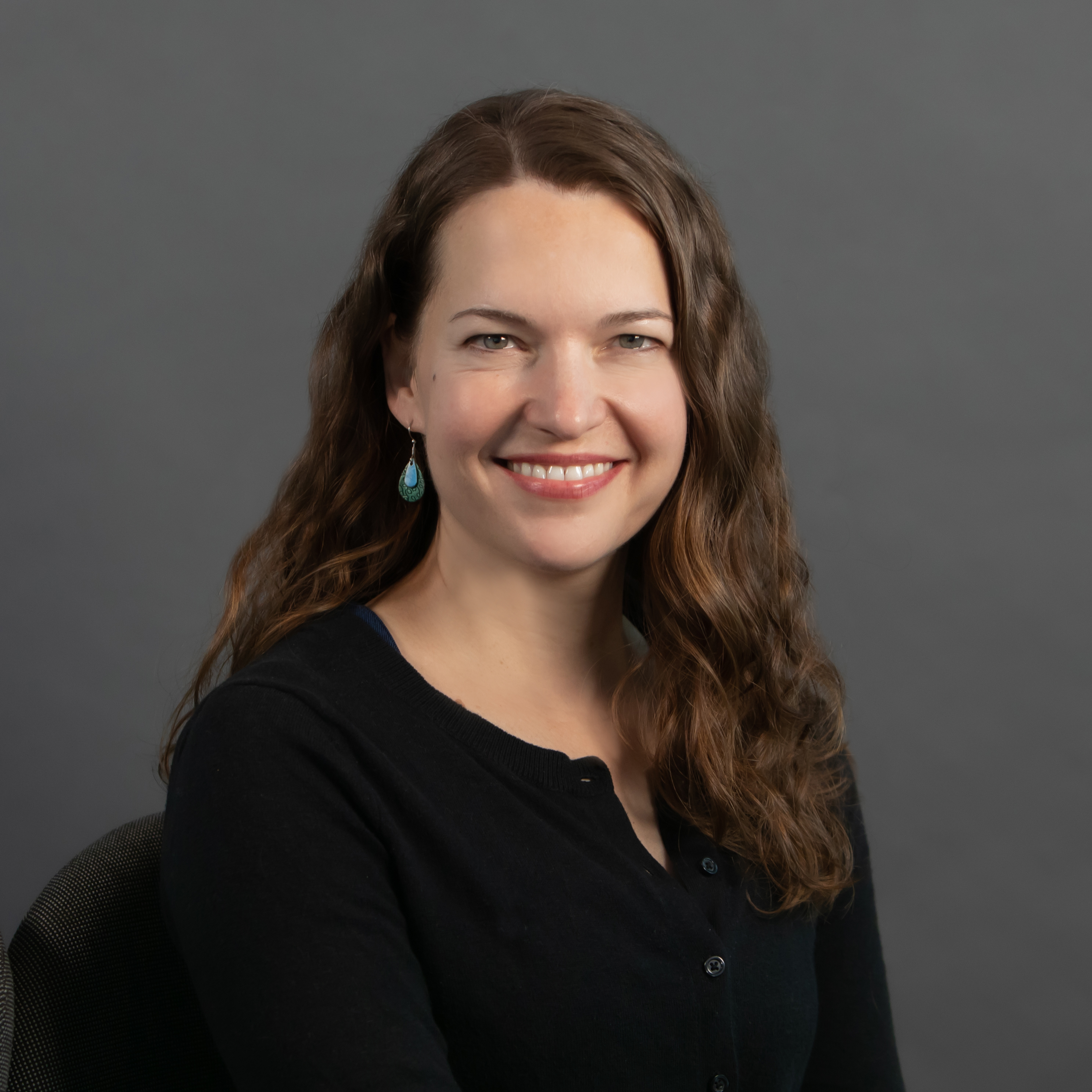 Dr. Alison Christy smiles against a neutral background