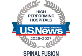 A silver badge that reads "High Performing Hospitals" for "Spinal Fusion" along with the U.S. News & World Report logo and the years 2026-2027.