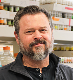 Head shot of Dr Marc Freeman in his research lab