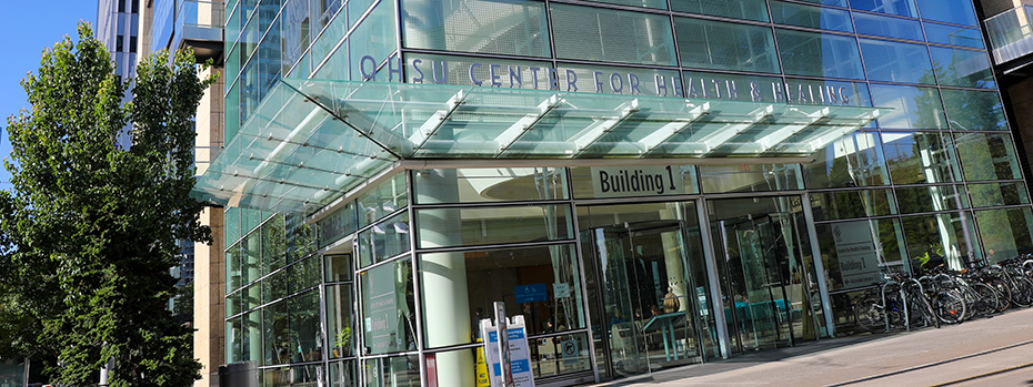 The front exterior entrance of OHSU's Center for Health & Healing Building 1 on a sunny day.