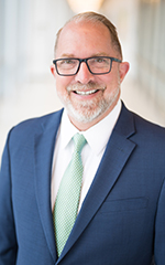 A professional photo of Joel Helmke.