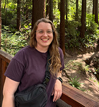 Lauren Kee on a bridge in the forest