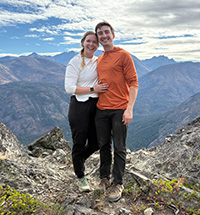 Mary First with her partner on a mountaintop