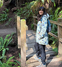 Marya Ali on a bridge in the forest