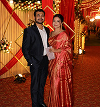 Payal Dey posing with her partner in evening attire