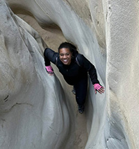 Peyton Johnson deep inside a slot canyon