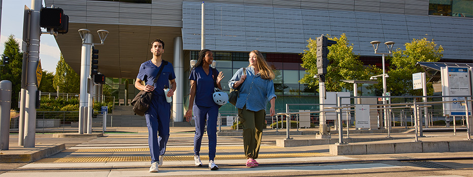 OHSU students cross the street on campus near the Robertson Life Sciences Building.