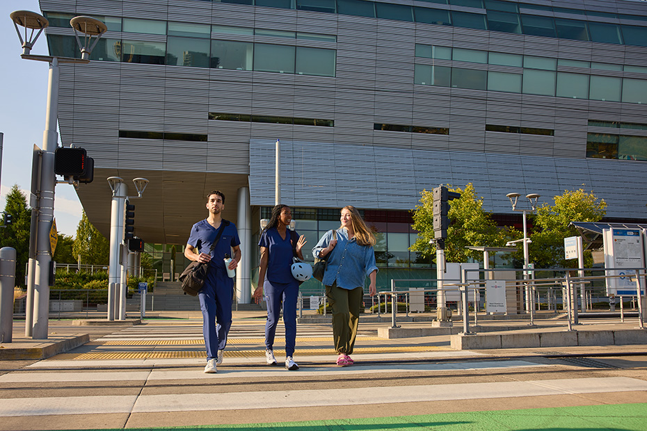 OHSU students cross the street on campus near the Robertson Life Sciences Building.