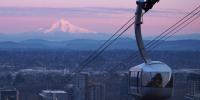 OHSU Air Tram in the evening with Mt. Hood in the distance.